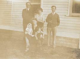 A picture containing sitting, building

Description automatically generated